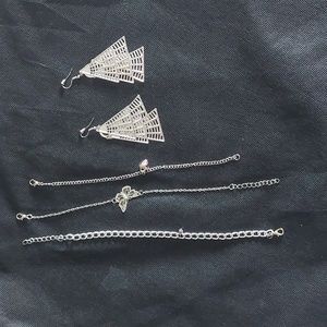 Silver earrings and 3 added accessories.
